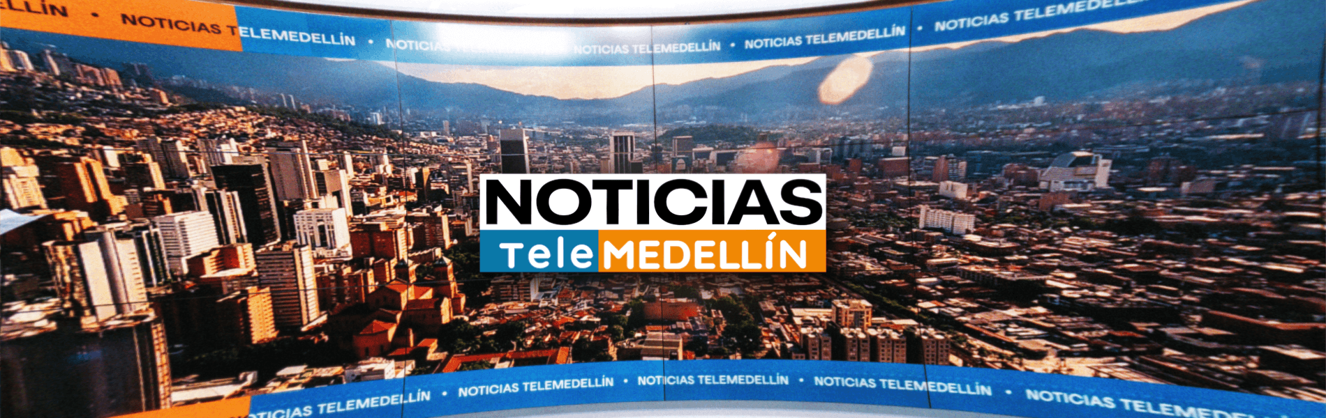 Banner con el logo de Noticias Telemedellín y una imagen de la ciudad de fondo